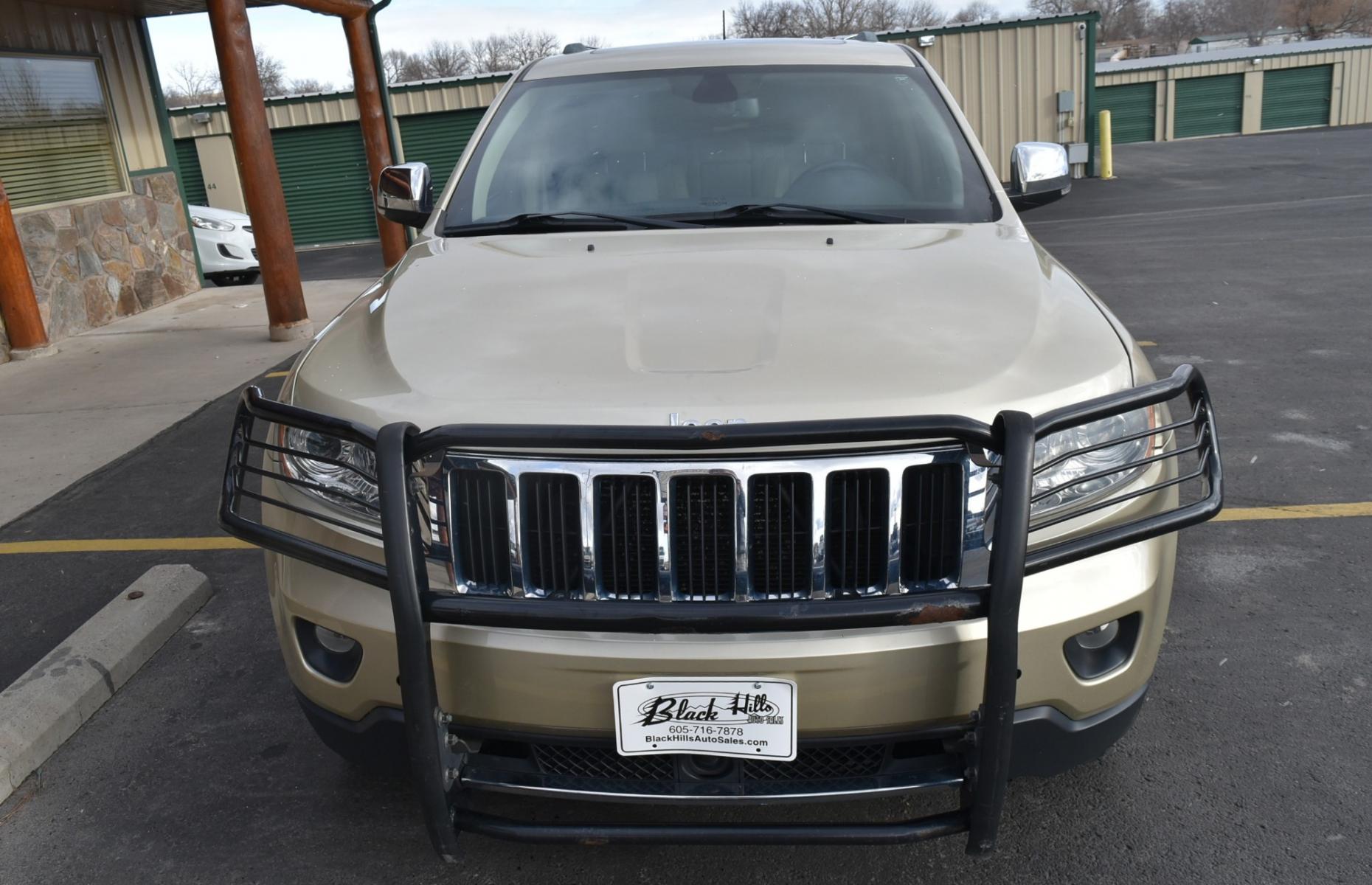 2011 Gold /Tan Jeep Grand Cherokee Limited (1J4RR5GT9BC) with an 5.7L HEMI V-8 engine, 5-Speed Automatic transmission, located at 1600 E Hwy 44, Rapid City, SD, 57703, (605) 716-7878, 44.070232, -103.171410 - Photo #1